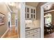 Butler's Pantry with beautiful countertop, a sink, and cabinetry for entertaining at 1329 Wynncrest Ct, Raleigh, NC 27603