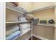 Organized walk-in closet with shelving provides ample storage space for clothing, shoes, and accessories at 1329 Wynncrest Ct, Raleigh, NC 27603