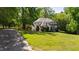 Charming home with manicured lawn, mature trees, and a welcoming facade in a serene setting at 1329 Wynncrest Ct, Raleigh, NC 27603