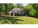 Beautiful home with well-kept lawn, mature trees, and a picturesque facade in a tranquil neighborhood at 1329 Wynncrest Ct, Raleigh, NC 27603