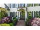 Close up of front entrance featuring double doors, brick steps, and manicured landscaping at 1329 Wynncrest Ct, Raleigh, NC 27603