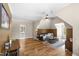 Spacious living room with hardwood floors, vaulted ceilings, and natural light, perfect for relaxing and entertaining at 1329 Wynncrest Ct, Raleigh, NC 27603