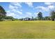 Open-air outbuilding with a metal roof, set against a backdrop of lush greenery and a clear blue sky at 155 G Herring Rd, Princeton, NC 27569