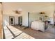 Covered porch with ceiling fans and seating at 155 G Herring Rd, Princeton, NC 27569