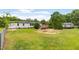 Lush backyard with home, deck and detached garage at 165 Dawn Rd, Benson, NC 27504