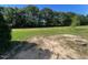 Spacious backyard with fresh green grass and fire pit, ideal for outdoor entertaining at 165 Dawn Rd, Benson, NC 27504