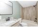 Beautiful bathroom boasts tiled shower, modern vanity and a built in cabinet at 165 Dawn Rd, Benson, NC 27504