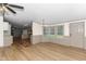 Open floor plan showing dining area with updated chandelier and view to kitchen at 165 Dawn Rd, Benson, NC 27504