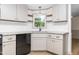 Stylish kitchen featuring granite countertops, white cabinetry, and stainless steel appliances at 165 Dawn Rd, Benson, NC 27504