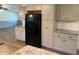 Bright kitchen with granite countertops, stainless refrigerator, and ample cabinet space at 165 Dawn Rd, Benson, NC 27504