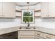 Modern kitchen with stainless steel sink, granite countertops, and white subway tile backsplash at 165 Dawn Rd, Benson, NC 27504