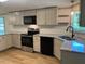 Bright kitchen boasts granite countertops, stainless steel appliances, and white subway tile backsplash at 165 Dawn Rd, Benson, NC 27504