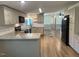 Spacious open kitchen with granite countertops, modern appliances, and wood flooring at 165 Dawn Rd, Benson, NC 27504