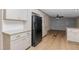 Open kitchen space with stainless steel refrigerator and modern finishes at 165 Dawn Rd, Benson, NC 27504