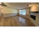 Inviting living room with wood-look flooring and an electric fireplace at 165 Dawn Rd, Benson, NC 27504