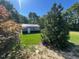 Outbuilding with a metal roof on a sunny lot at 165 Dawn Rd, Benson, NC 27504