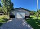 New metal outbuilding with gravel driveway, perfect for storage and outdoor activities at 165 Dawn Rd, Benson, NC 27504
