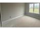 Bright bedroom featuring a window and a view of the field outside at 168 Clayton Rd, Princeton, NC 27569