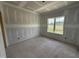 Bright bedroom featuring a window, recessed lighting, and tray ceiling, awaiting personalized finishing touches at 168 Clayton Rd, Princeton, NC 27569