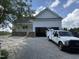 New construction home featuring an attached garage, gravel driveway and a truck parked in front at 168 Clayton Rd, Princeton, NC 27569