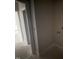 Bright hallway leading to a laundry room and other areas of the home at 168 Clayton Rd, Princeton, NC 27569