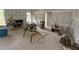 Open-concept living room with fireplace and large windows, under construction with drywall installed at 168 Clayton Rd, Princeton, NC 27569