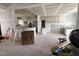 Open-concept living space featuring unfinished kitchen with white cabinetry at 168 Clayton Rd, Princeton, NC 27569