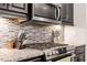 Well-equipped kitchen with stainless steel appliances and tile backsplash at 174 Walking Path Pl, Hillsborough, NC 27278