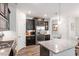 Modern kitchen with stainless steel appliances, granite counters and dark cabinets at 174 Walking Path Pl, Hillsborough, NC 27278