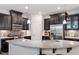 Spacious kitchen with a large island, dark cabinetry, and modern appliances at 174 Walking Path Pl, Hillsborough, NC 27278