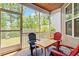Enjoy outdoor living on this screened porch with table and chairs, perfect for relaxing or entertaining at 174 Walking Path Pl, Hillsborough, NC 27278