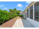 A backyard provides a tranquil retreat with manicured hedges and a concrete patio at 204 Dowington Ln, Cary, NC 27519
