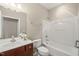 Bathroom featuring a vanity, toilet, and tub with shower at 204 Dowington Ln, Cary, NC 27519