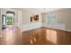 This spacious room features neutral walls, hardwood floors, wainscotting, and ample sunlight at 204 Dowington Ln, Cary, NC 27519