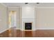 Fireplace with white mantle and black hearth in a living room or Gathering area at 204 Dowington Ln, Cary, NC 27519