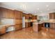 The kitchen boasts wood cabinetry, countertop space, and stainless steel appliances at 204 Dowington Ln, Cary, NC 27519