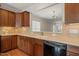 A kitchen featuring wood cabinets, hardwood floors, recessed lighting, and stainless steel appliances at 204 Dowington Ln, Cary, NC 27519