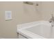 Close up of a laundry sink with modern faucet at 204 Dowington Ln, Cary, NC 27519