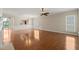 Open concept living space featuring hardwood flooring, natural light, and views to the kitchen at 204 Dowington Ln, Cary, NC 27519