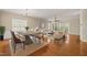The open floorplan connects living and dining areas, showcasing hardwood floors and plenty of natural light at 204 Dowington Ln, Cary, NC 27519
