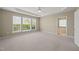 Spacious main bedroom includes tray ceiling, plush carpet, and ensuite bathroom access at 204 Dowington Ln, Cary, NC 27519