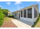 Back patio and screened in porch create a beautiful outdoor living space, perfect for relaxing at 204 Dowington Ln, Cary, NC 27519