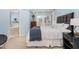 Comfortable bedroom showcases a queen-size bed, bedside table with a lamp, and soft, natural light at 209 Woodstar Dr, Cary, NC 27513