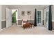 Inviting bedroom with cozy chair, side table, and a view of the outdoors at 209 Woodstar Dr, Cary, NC 27513