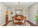 Elegant dining room showcasing a stylish chandelier, round table, and tasteful décor at 209 Woodstar Dr, Cary, NC 27513