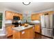 Bright kitchen with stainless appliances, granite counters, and ample cabinet space at 209 Woodstar Dr, Cary, NC 27513
