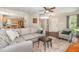 Open living space with seamless flow to the kitchen and staircase, featuring hardwood floors at 209 Woodstar Dr, Cary, NC 27513