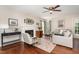 Cozy living room featuring a fireplace, ceiling fan, and comfortable seating arrangement at 209 Woodstar Dr, Cary, NC 27513