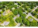 Aerial view of neighborhood with many trees, homes, and street intersections at 2107 Somers Ave, Burlington, NC 27215