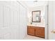 Bathroom with traditional-style vanity, offering a storage and a closet nearby at 2107 Somers Ave, Burlington, NC 27215